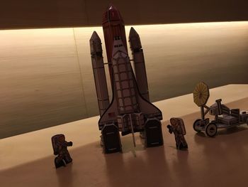High angle view of toy on table by sea