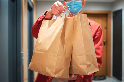 Midsection of woman holding gift