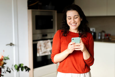 Young woman using mobile phone