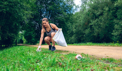 Portrait of woman cleaning park