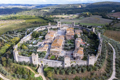 Italy, tuscany, monteriggioni, aerial view of medieval walled village