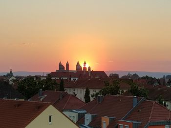 Buildings against sky during sunset