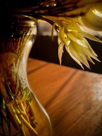 Close-up of yellow rose on table