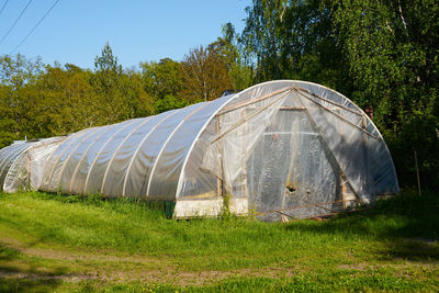 Tent in field against sky