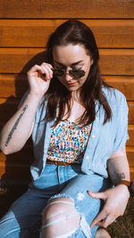 Young woman sitting in a dress