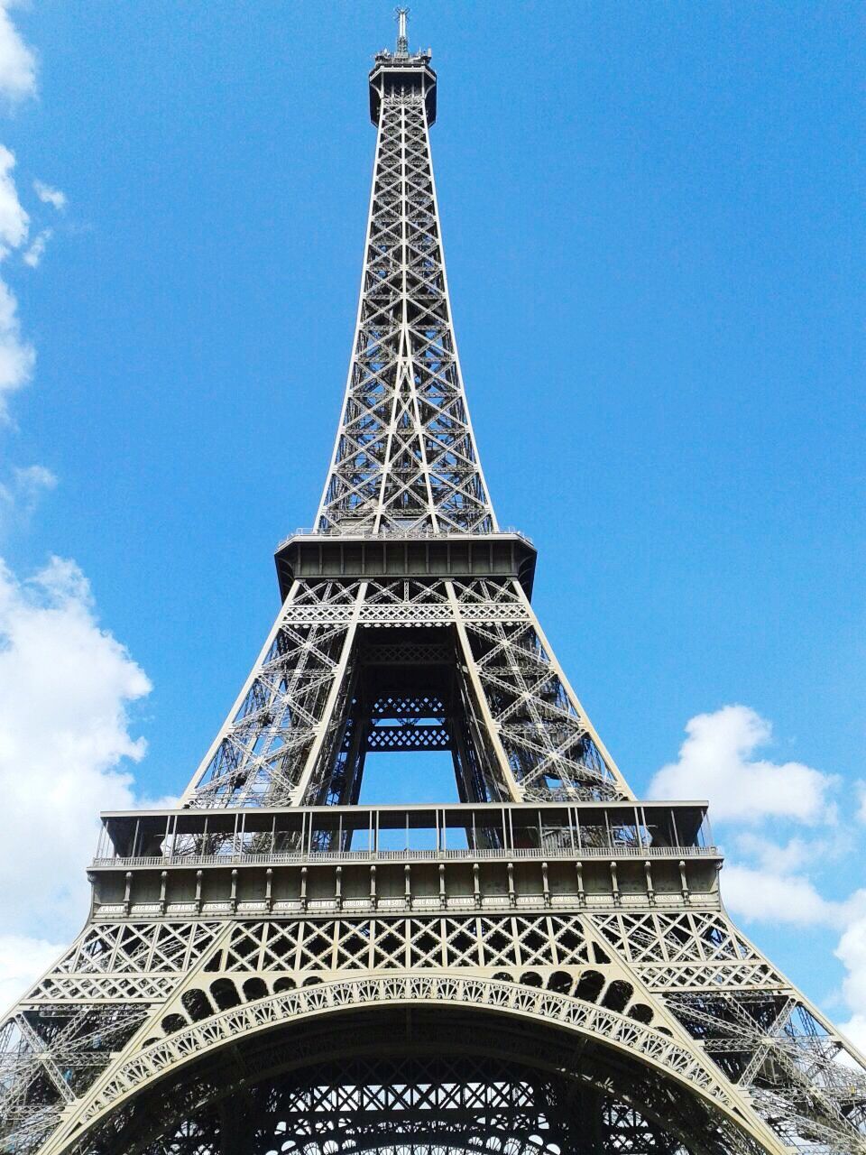 eiffel tower, architecture, famous place, international landmark, built structure, tower, low angle view, travel destinations, tourism, culture, tall - high, capital cities, travel, metal, history, architectural feature, sky, blue, metallic, day