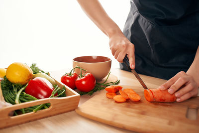 Man preparing food on cutting board