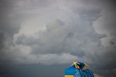 Low angle view of toy car against sky