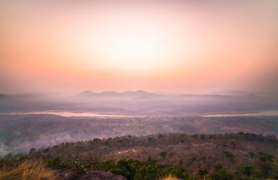 Scenic view of landscape against sky during sunset