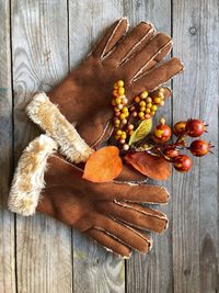 Directly above shot of gloves with pumpkins