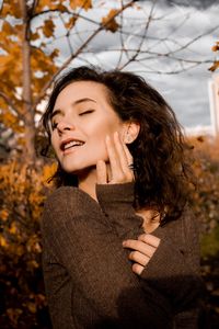 Close-up of young woman during autumn