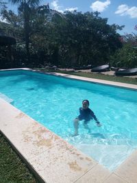 Man swimming in pool