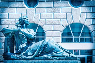 Close-up of statue against building