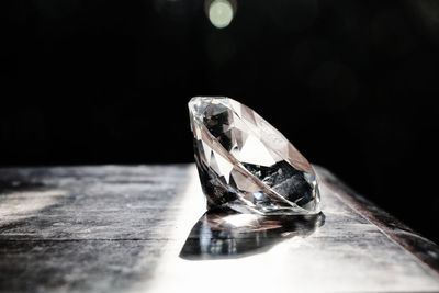 Close-up of diamond on table