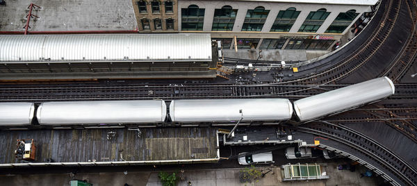 Directly above shot of train at railroad station in city