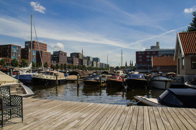 Boats moored in front of buildings