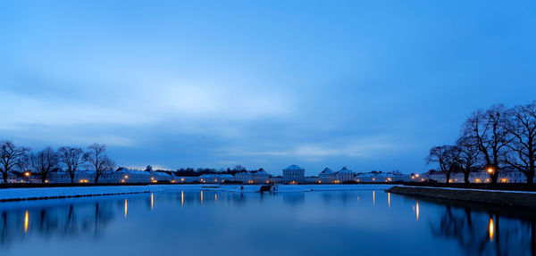 Scenic view of lake against sky during winter