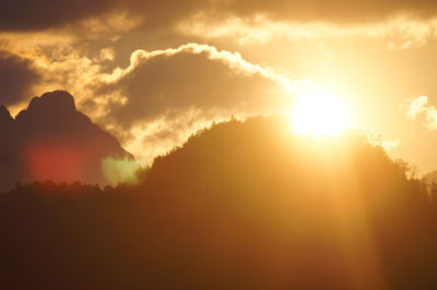 Scenic view of silhouette mountains against sky during sunset