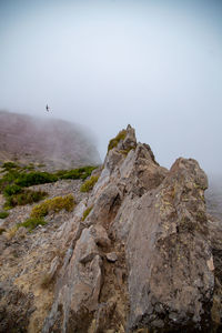 Rock formations on mountain against sky