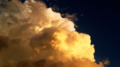 Low angle view of dramatic sky during sunset