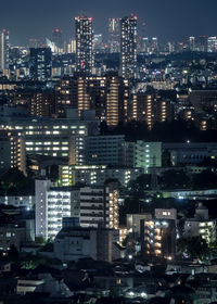 Illuminated buildings in city at night