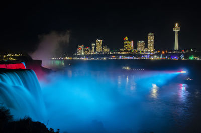 Illuminated buildings in city at night