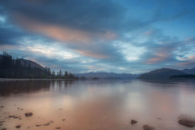 Amazing view of wanaka lake during evening with snowcapped mountains in background.new zealand.