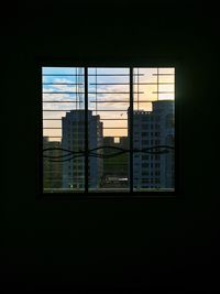 Built structure against sky at sunset