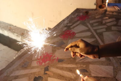 Person hand holding fire crackers