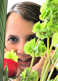 Close-up portrait of woman with flowers