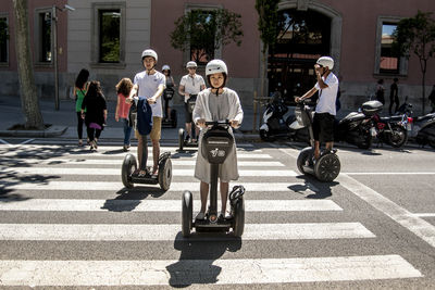 People riding bicycles on road