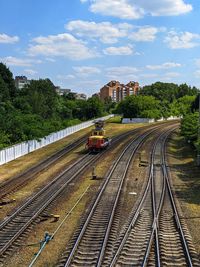 Train on railroad tracks against sky