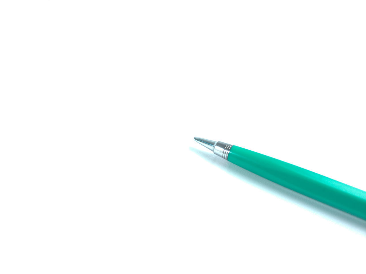 HIGH ANGLE VIEW OF PENCILS OVER WHITE BACKGROUND