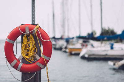 Life belt on pole at harbor