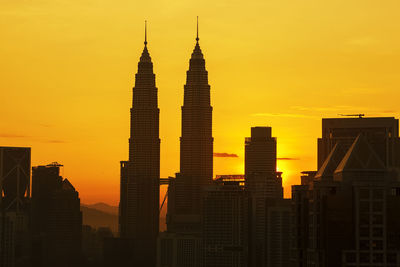 Two skyscrapers at sunset