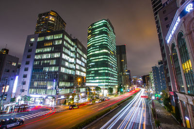 High angle view of light trails on road at night