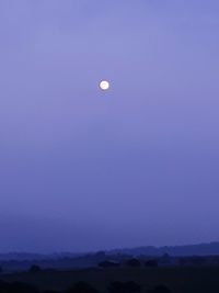 Scenic view of moon against clear sky at night