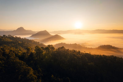 Scenic view of mountains against sky during sunset