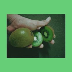 Close-up of hand holding fruit