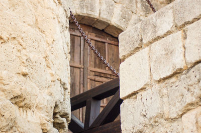 Low angle view of stone wall of old building