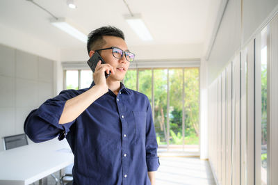 Young man using mobile phone