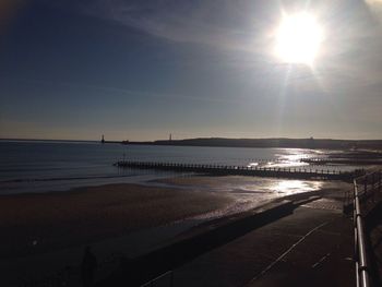 Scenic view of sea against sky at sunset