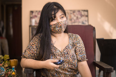 Portrait of a young woman using mobile phone