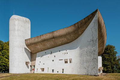 Low angle view of historical building against clear blue sky