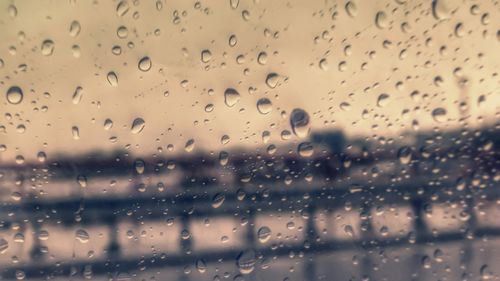 Full frame shot of wet glass window during rainy season