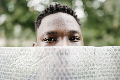 Young african american man portrait. plastic pollution, mental health concept