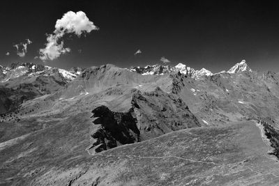 Scenic view of snowcapped mountains against sky