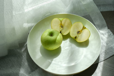 High angle view of fruits in bowl on table