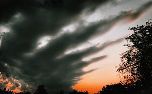 Low angle view of dramatic sky during sunset