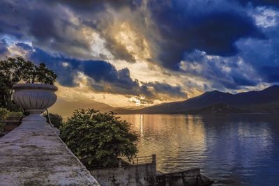 Scenic view of lake against sky during sunset